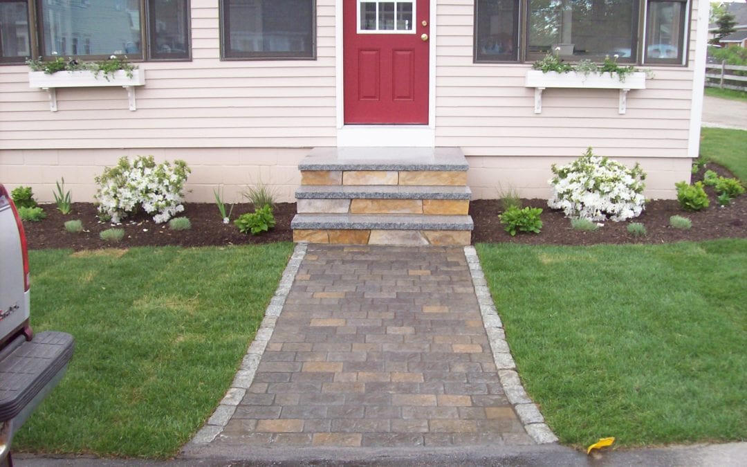 Stone paver walkway with natural stone steps and landscaping