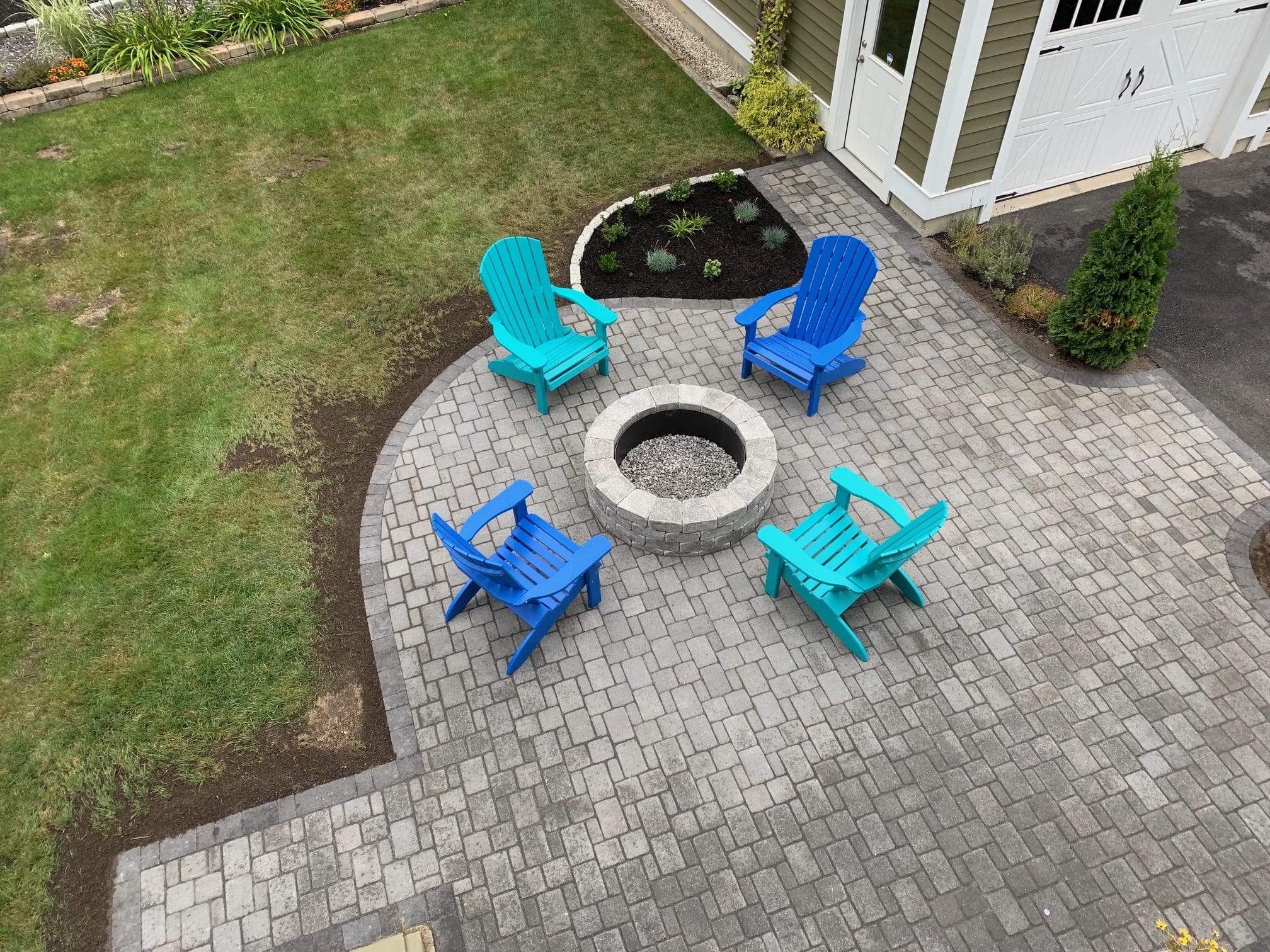 Stone Patio and Fireplace with Adirondack chairs