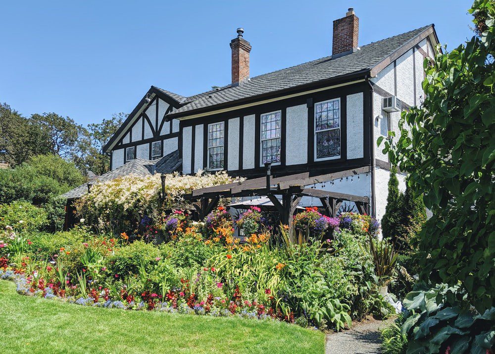 A flower bed in front of a home