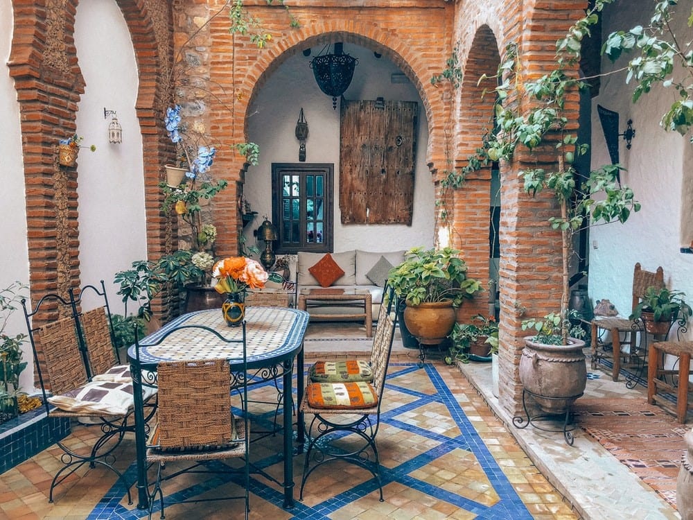 a vibrant blue and rustic mixed material patio