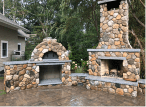 stonework fire pit in a backyard