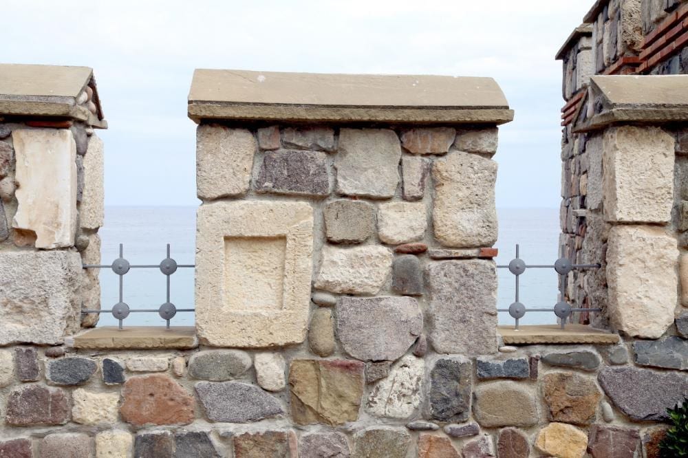 part of the exterior surface of a house with stonework