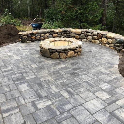 A fire pit made of stone veneer.