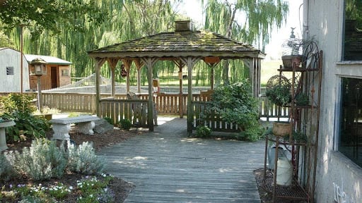 A wooden patio in the backyard.