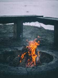 An outdoor fire pit made of stone