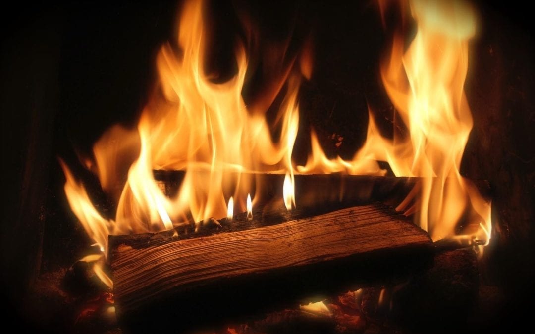 Burning wood in an outdoor fireplace