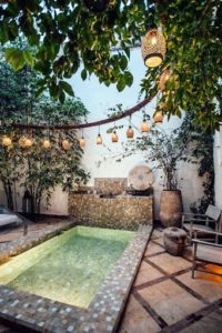 A patio decorated with string lights. 