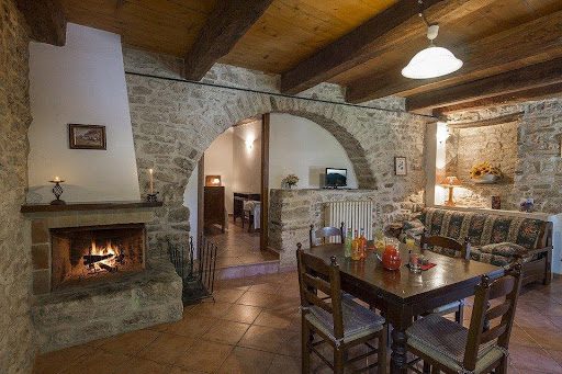 A room with a stone fireplace