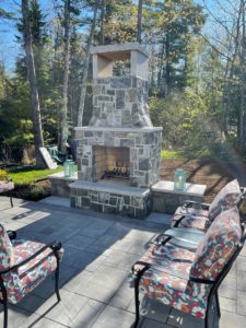 stone patio with fireplace