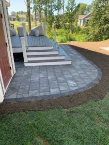 Stone patio with stars and nice landscaping