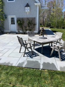 Custom stone patio with dining area