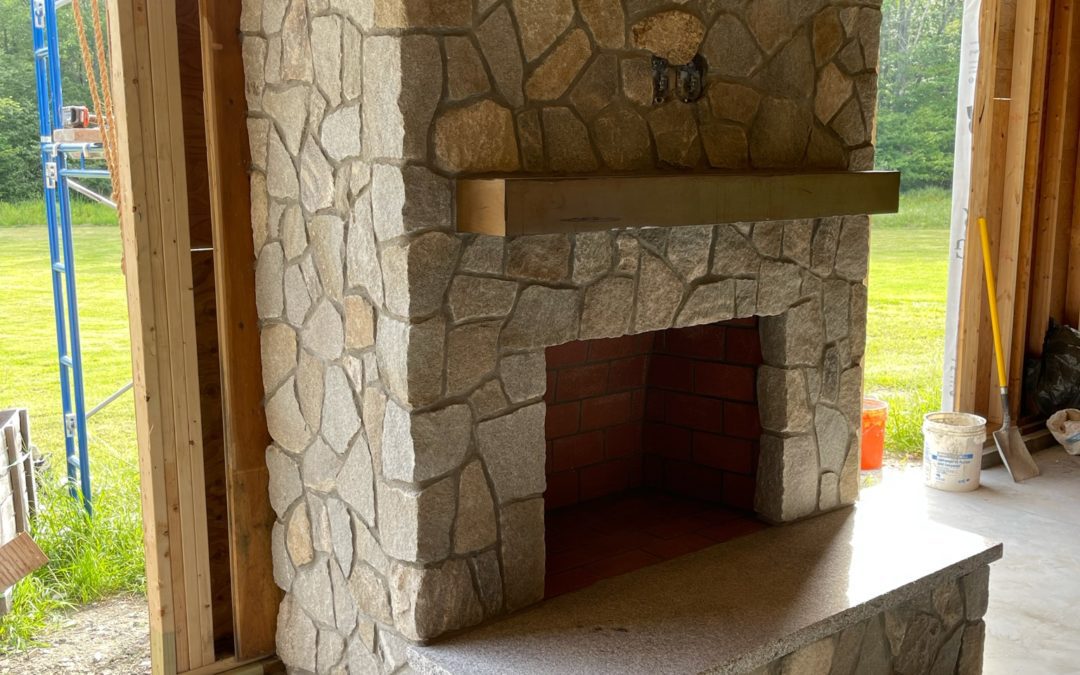 Stone fireplace with mantel