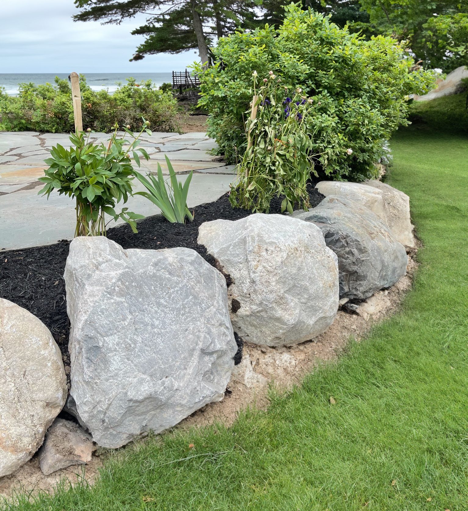 Boulders and rocks also provide functional benefits like erosion control