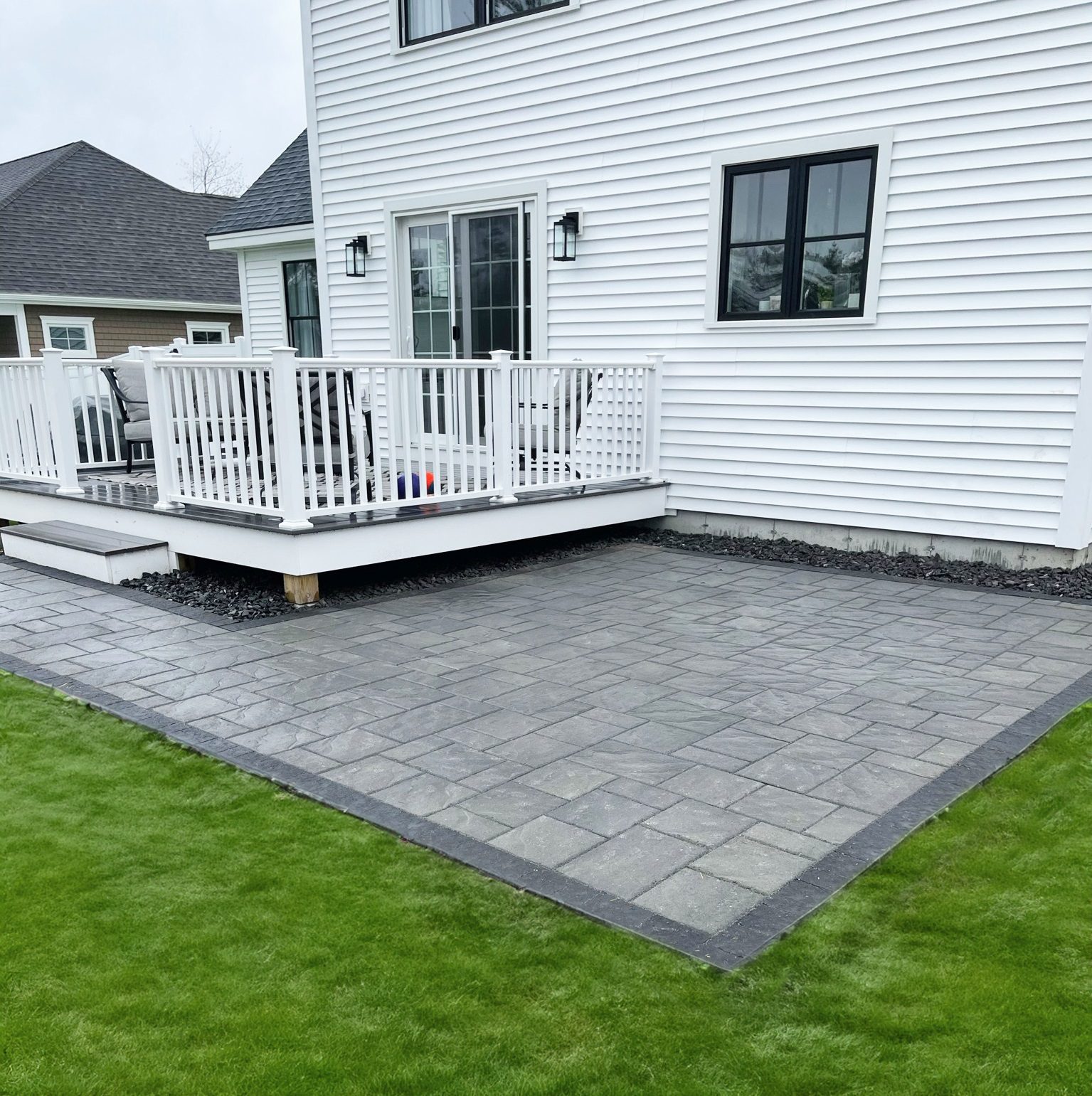 Deck with stone paver patio