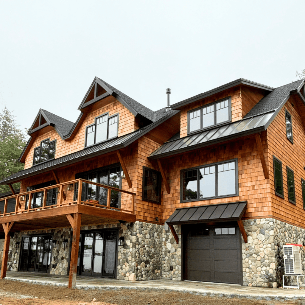 Natural stone siding on home exterior in Acton, Maine