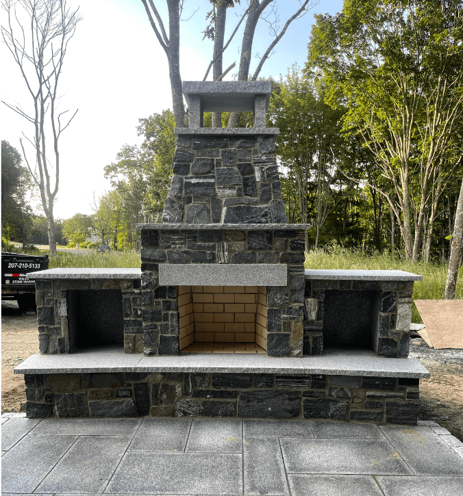 Outdoor fireplace with natural stone veneer 