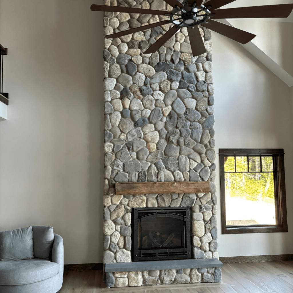 Lake rock stone veneer on fireplace