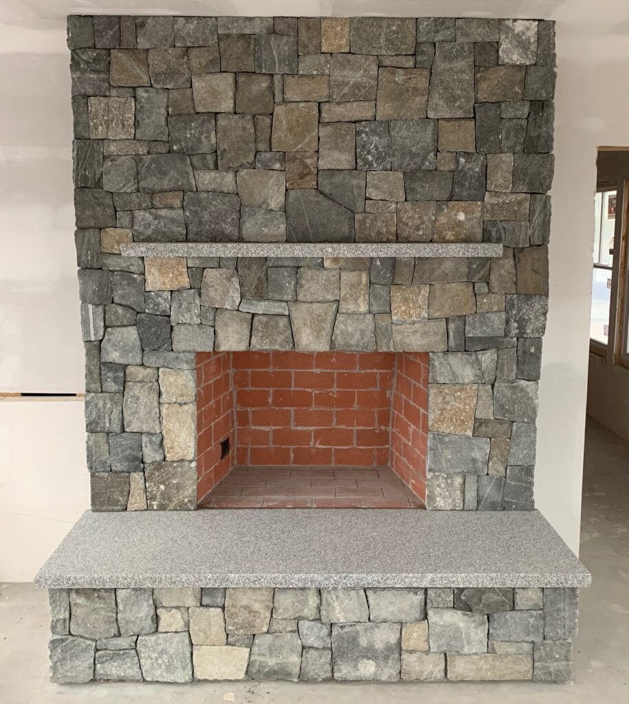 Stone veneer fireplace