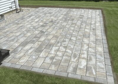warm-beige-variegated-concrete-paver-patio-running-bond-pattern-backyard