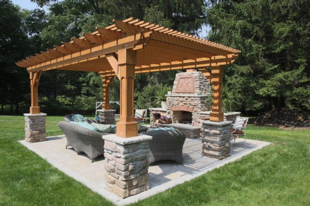 Pressure-treated pine pergola natural stone patio 