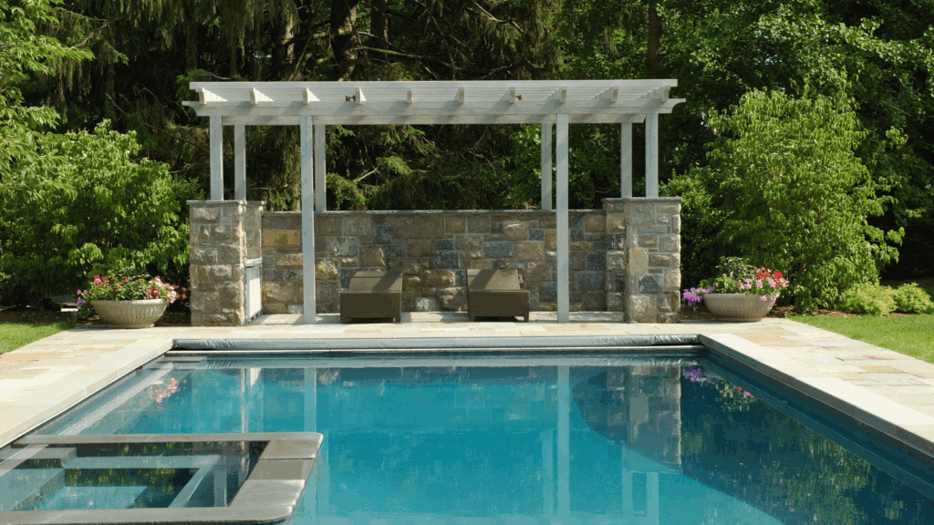 White pergola natural stone pool
