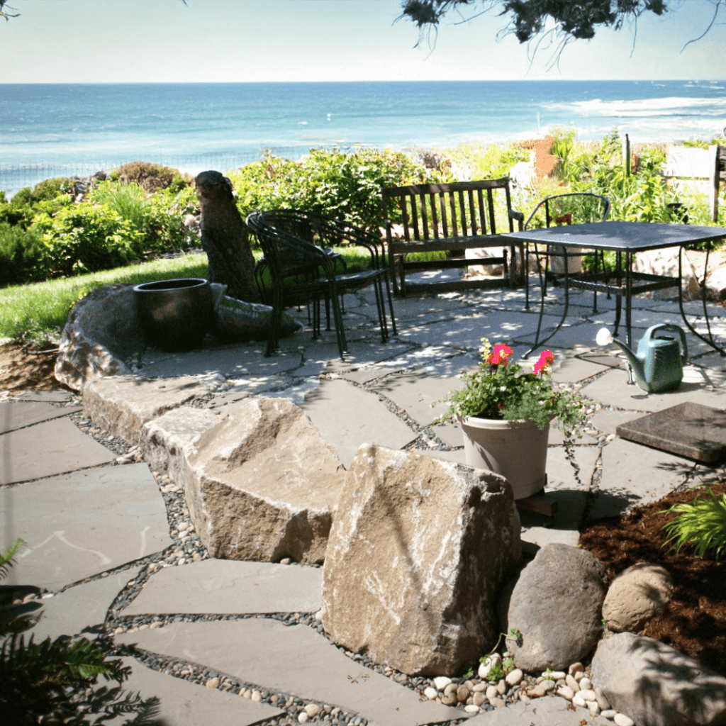 natural-stone-patio-ocean-view-rustic-boulders-coastal-landscaping