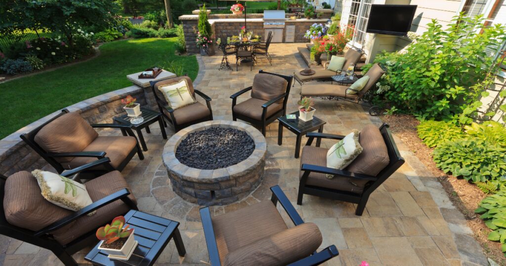 luxury-outdoor-living-space-stone-fire-pit-paver-patio