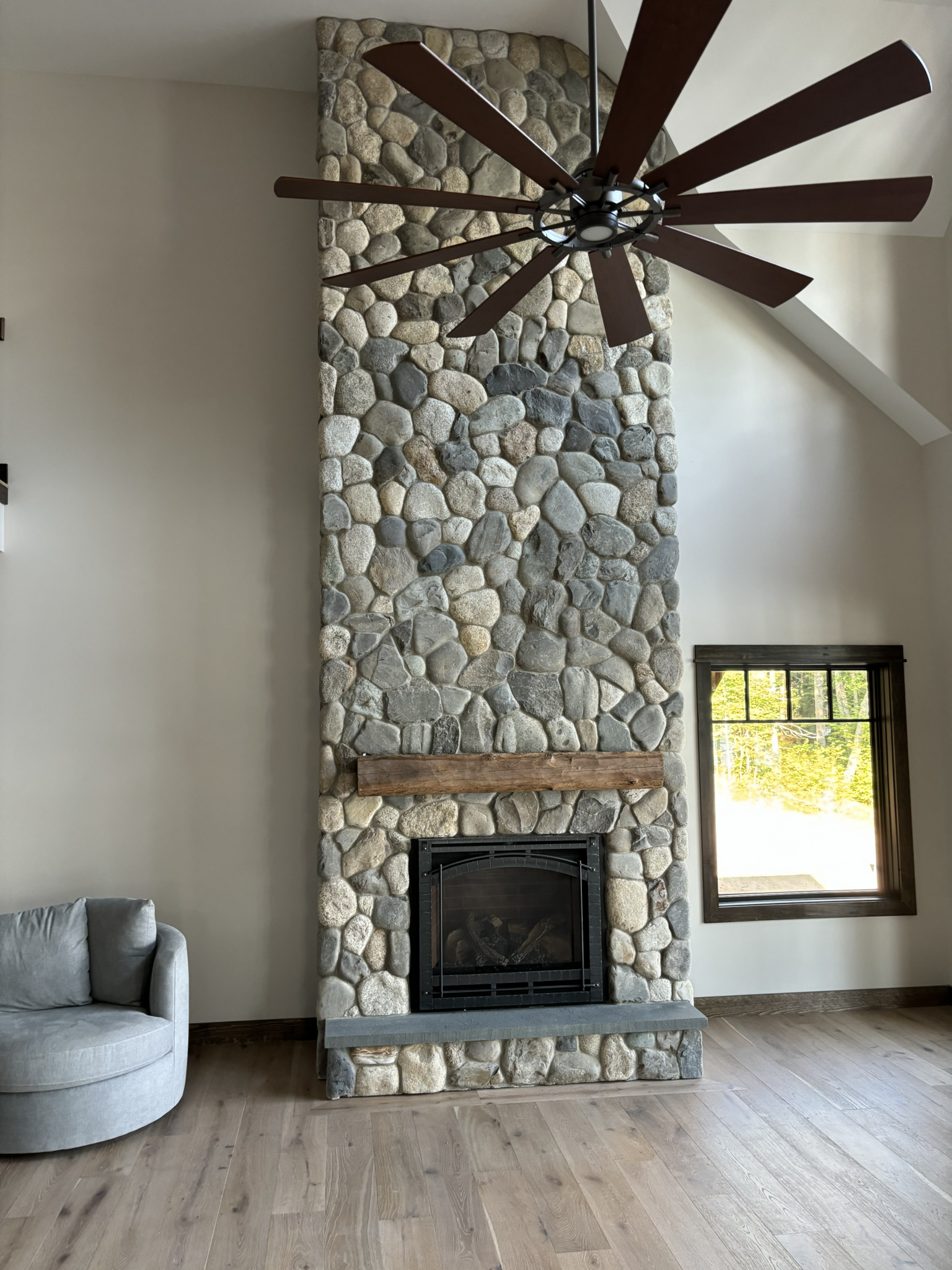 Lake rock stone veneer on fireplace