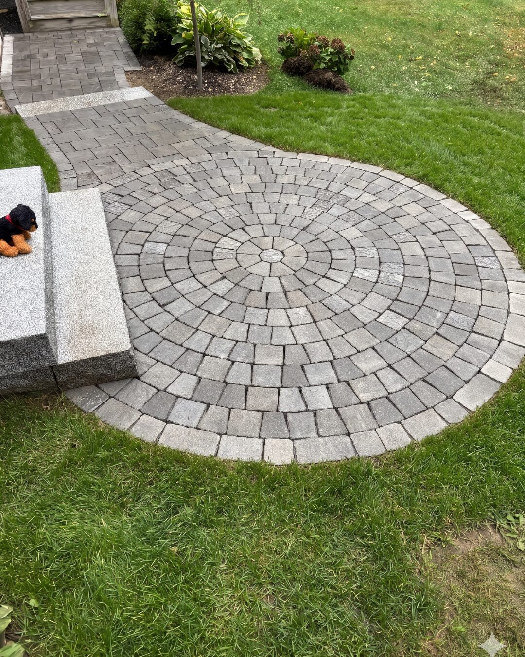 circular-stone-paver-patio-granite-entry-steps