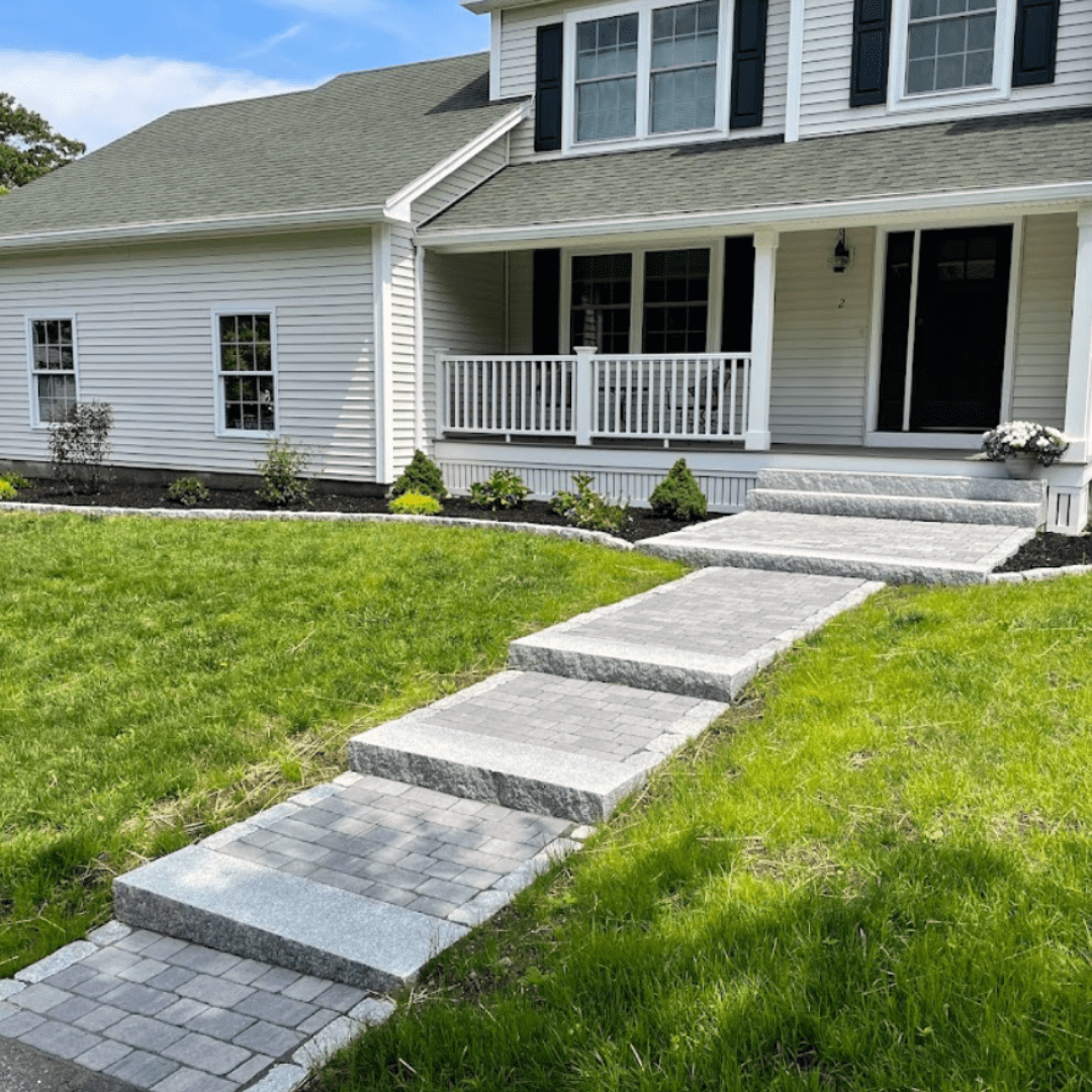 granite-step-paver-walkway-sloped-yard-colonial-home