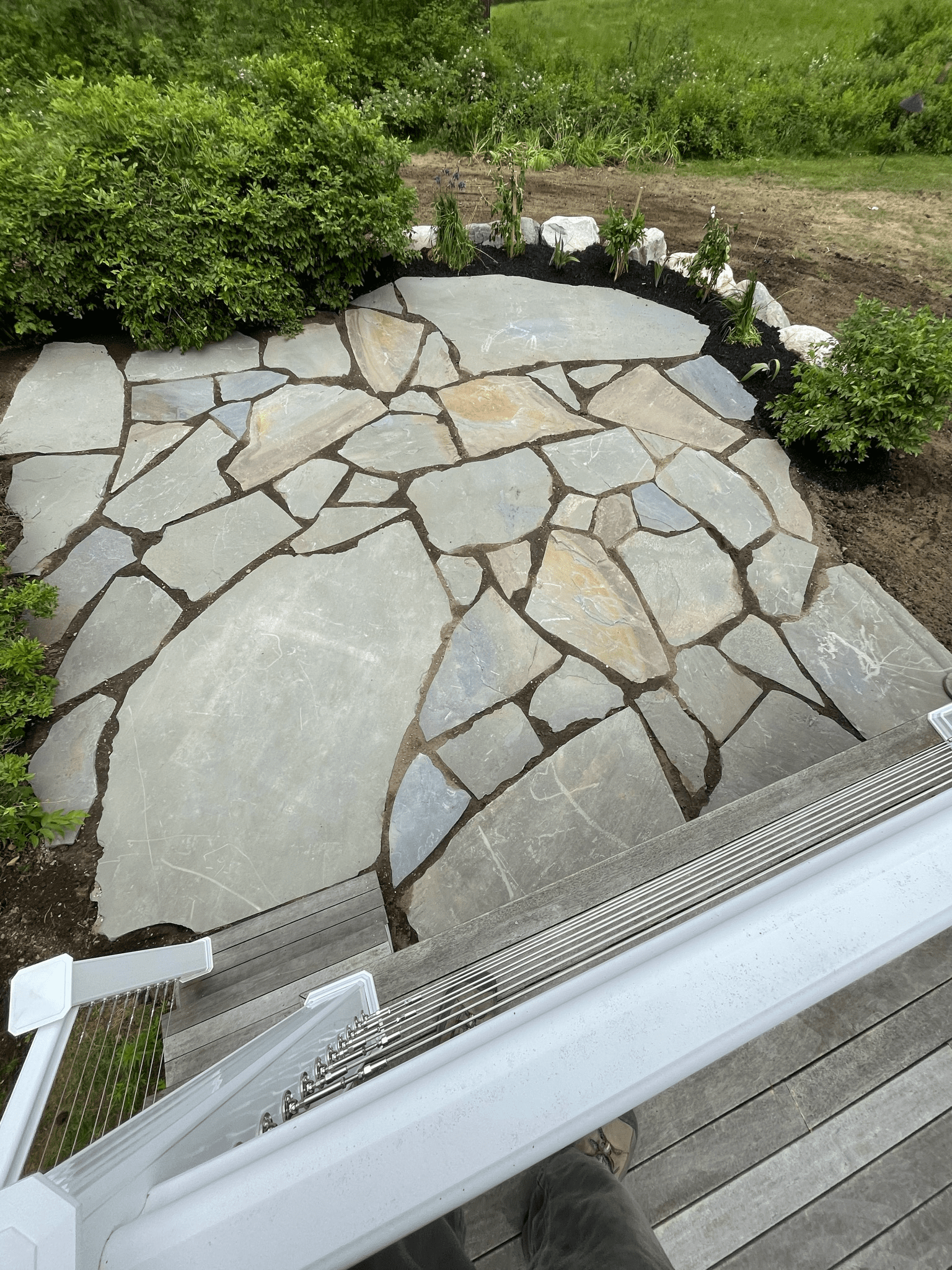 irregular-flagstone-round-patio-boulder-accent-garden-border-maine