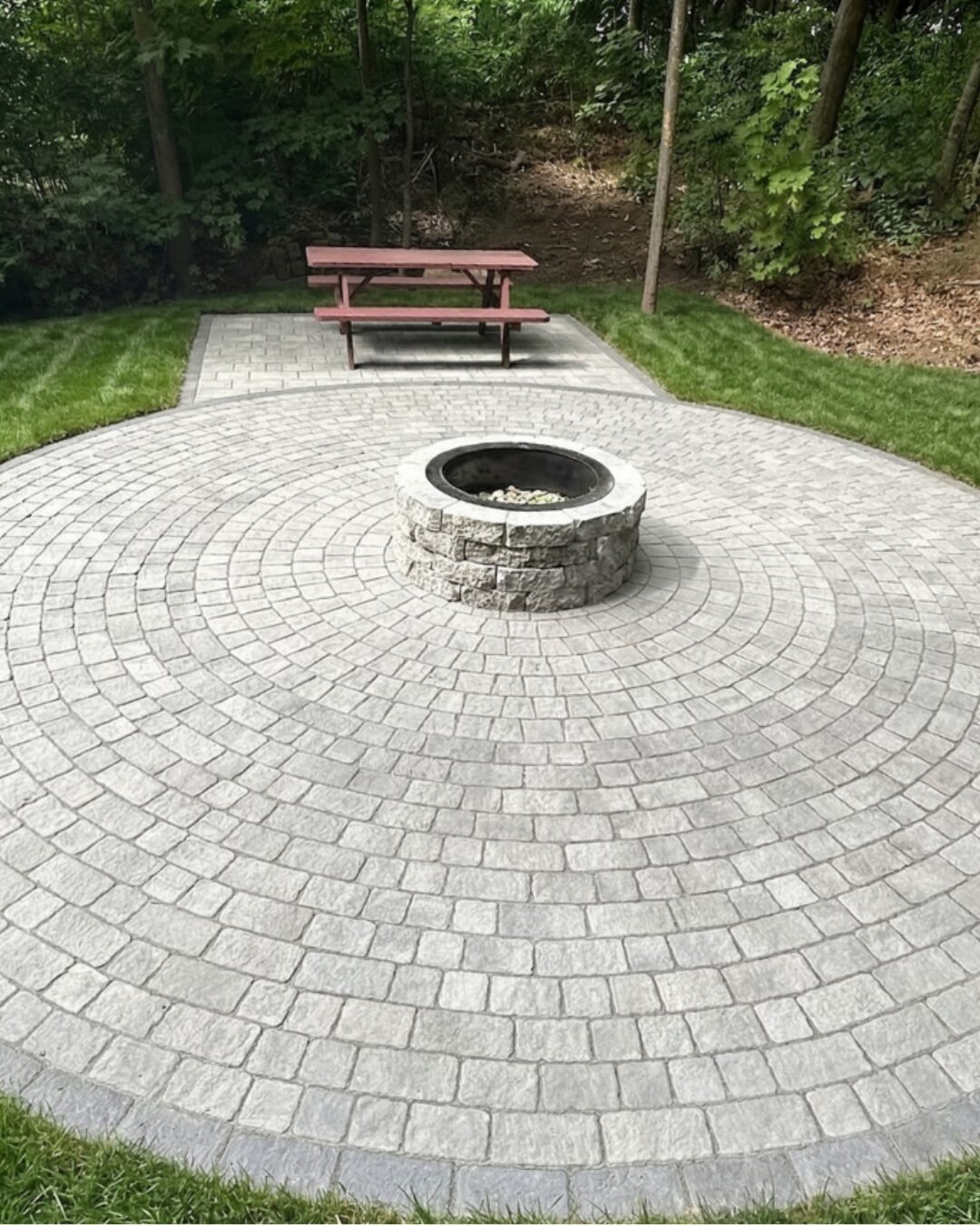 large-circular-paver-patio-with-stone-fire-pit