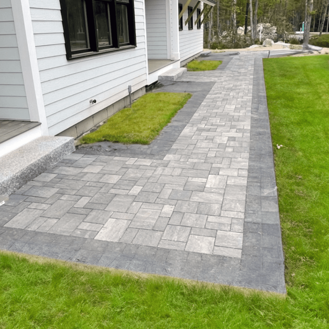 large-format-paver-patio-walkway-dark-border-modern-home
