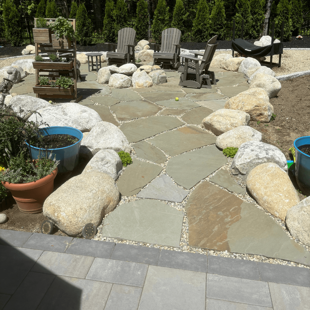 natural-flagstone-pathway-granite-boulder-border-outdoor-seating-area-maine