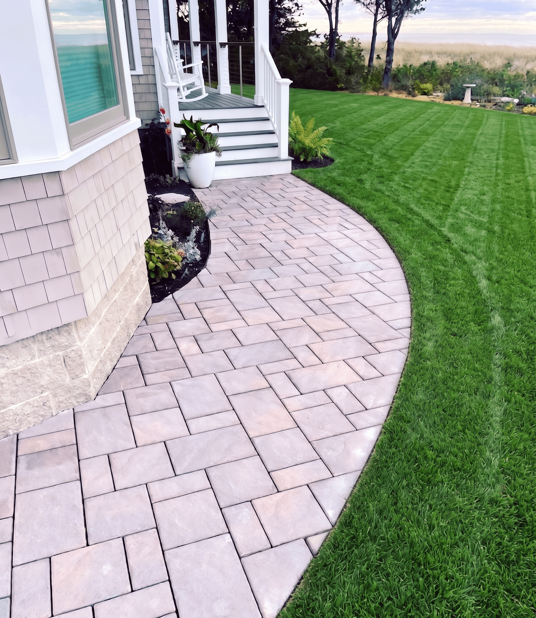 tan-paver-walkway-curved-shingle-coastal-home-new-england