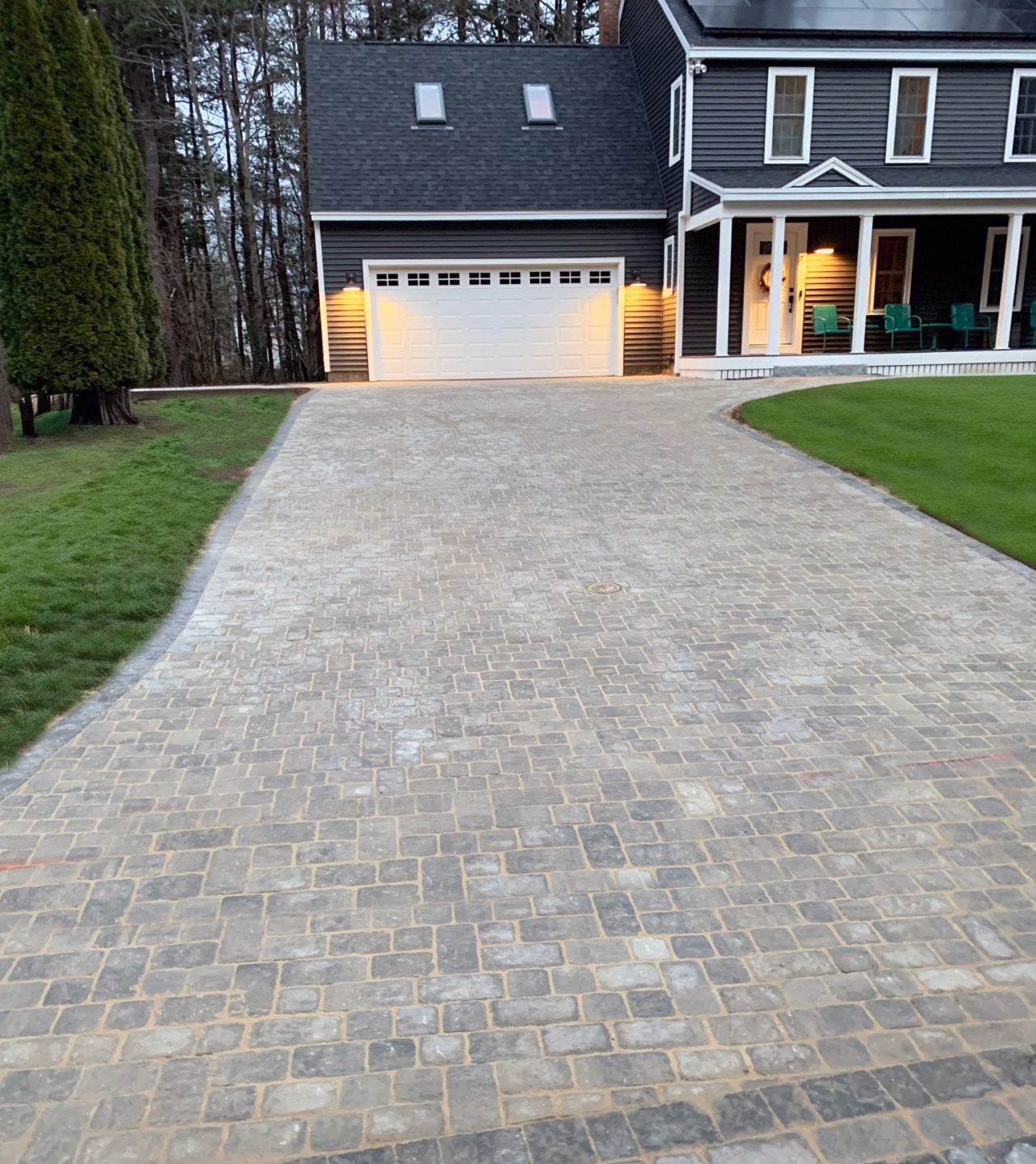 tumbled-cobblestone-paver-driveway-evening-curb-appeal-maine