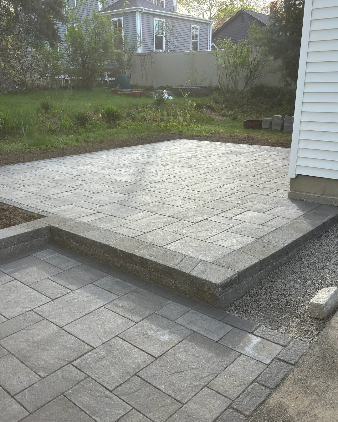 two-level-gray-paver-patio-raised-platform-charcoal-border-southern-maine