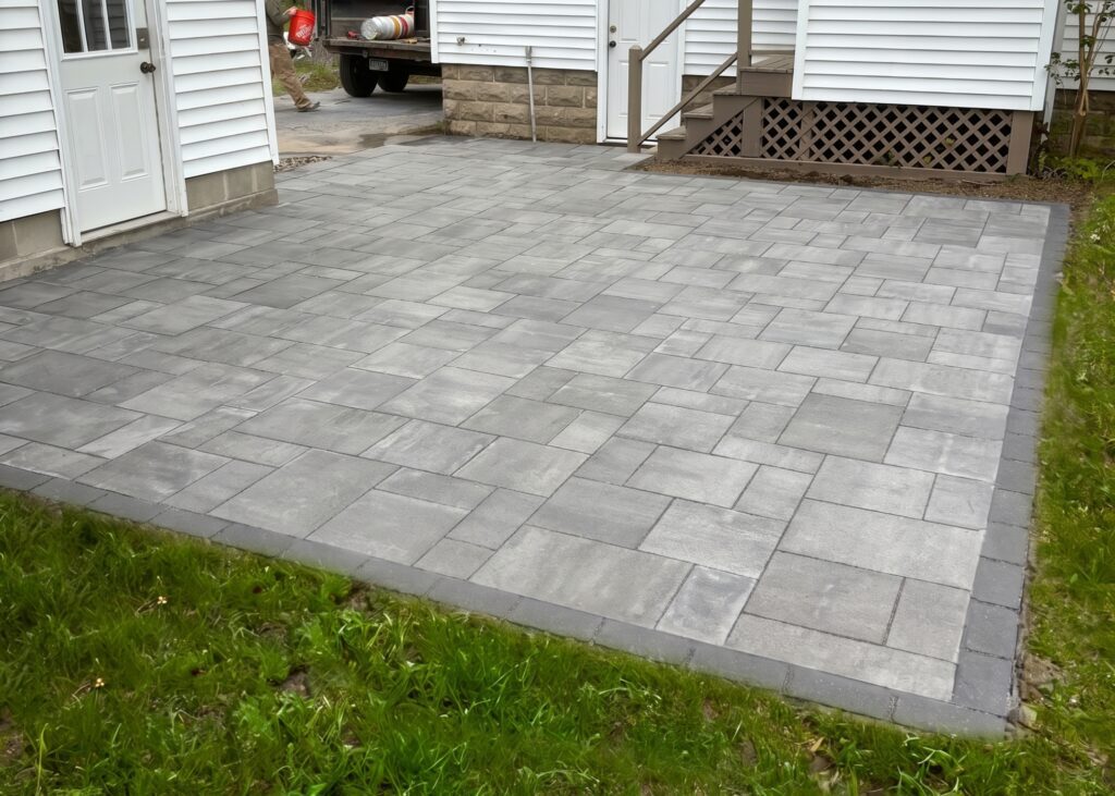 gray-large-format-paver-patio-back-door-entry-residential-scale
