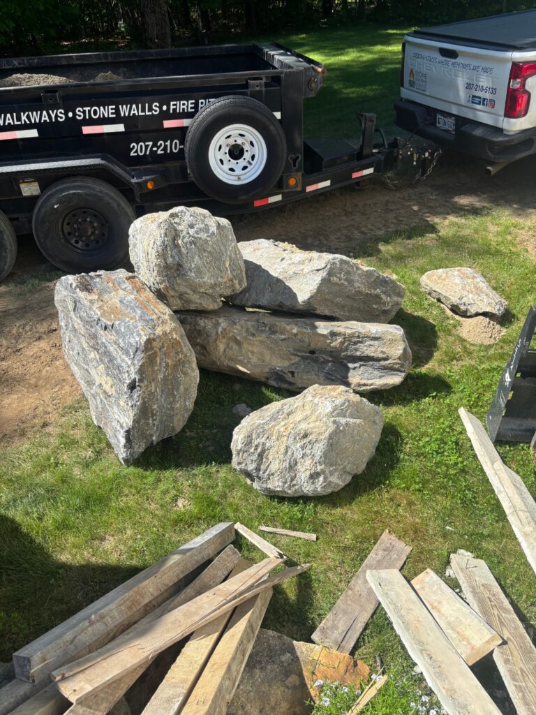 Large local boulders delivered by Stone Solutions Maine for a Pownal, Maine patio project